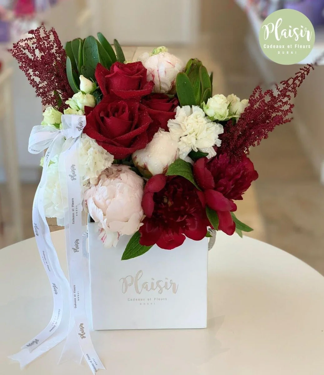 Festive Arrangement with Red and White Blooms By Plaisir