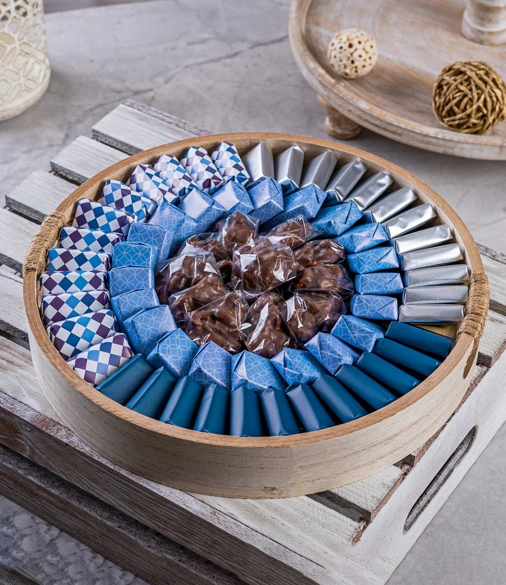 Wrapped Chocolate Arrangement in a Round Wooden Tray - Small