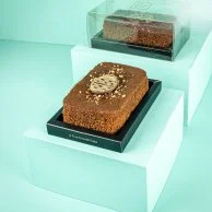 Date Cake topped with 3D Chocolates & Crushed Macadamia by The Date Room