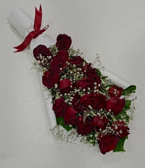 Red Roses in White Paper Wrapping