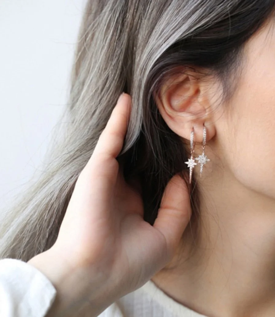 Glowing Star Drop Crystal Earrings in Rose Gold by NAFEES