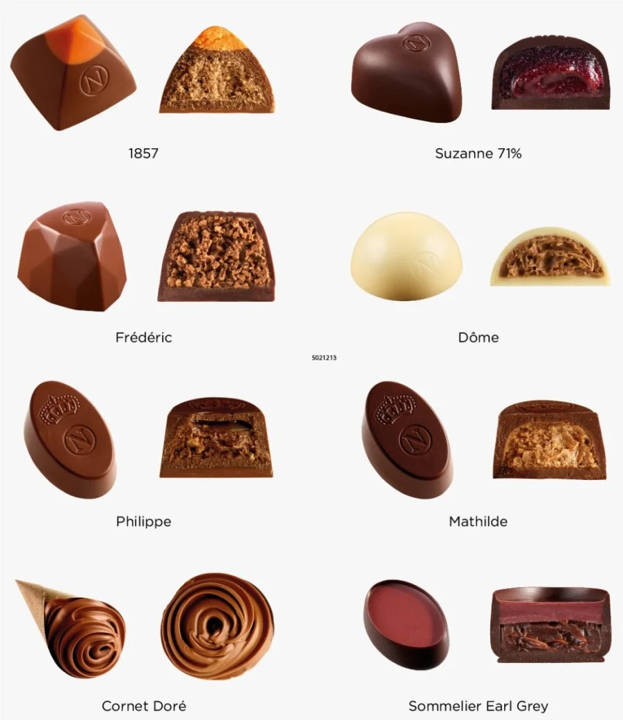 مجموعة ديسكوفيري ن نيوهاوس شوكولاتة حليب،  داكنة وبيضاء 24 قطعة شوكولاتة
