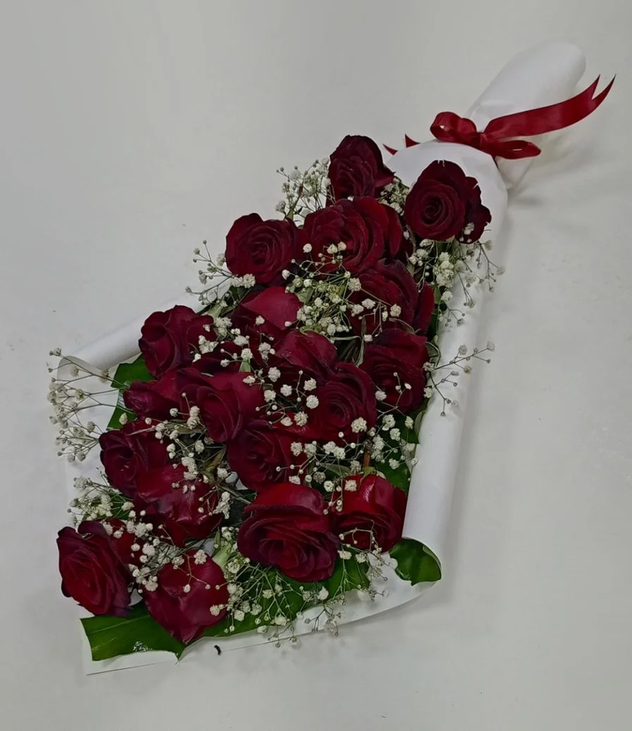 Red Roses in White Paper Wrapping